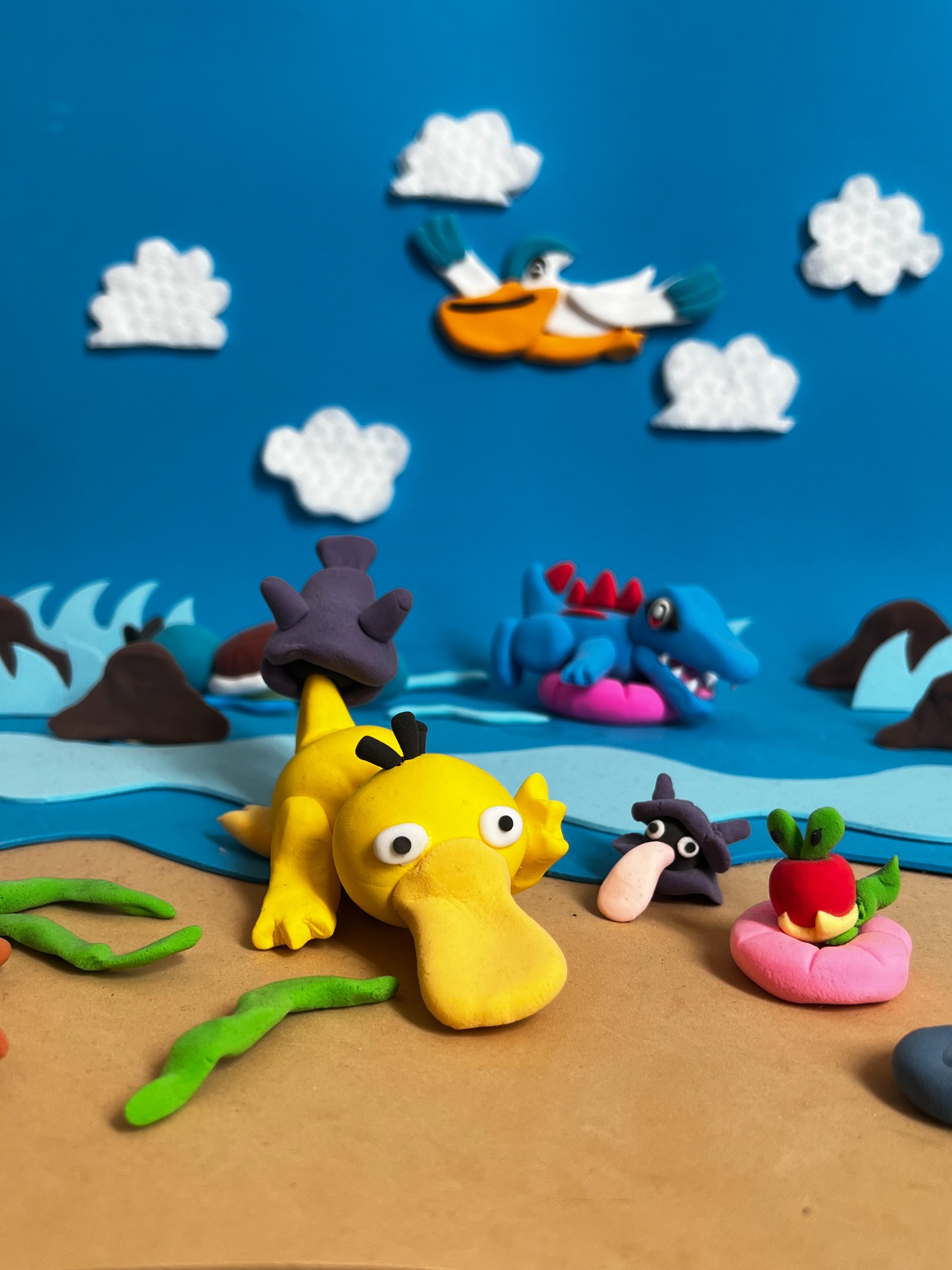 Psyduck y Totodile en la playa